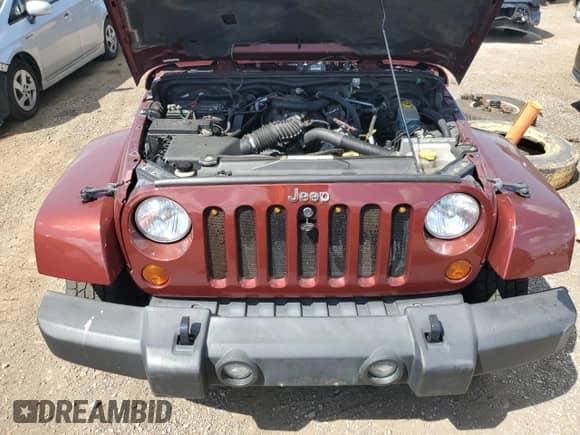 2007 Jeep Wrangler Sahara с VIN 1J8FA54107L160176, выставлен на аукционе Copart как лот 71033815 с пробегом 103 250 миль миль и Списание • Salvage title. История ставок и продаж доступна на DreamBid. Изображение 11.