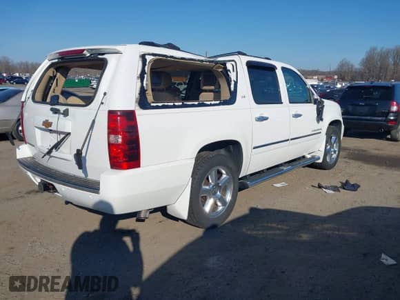 2014 Chevrolet Suburban LTZ z VIN 1GNSKKE7XER146467, wystawiony jako IAAI lot #41630210 z przebiegiem 159 533 mil mil oraz . Historia ofert i sprzedaży dostępna na DreamBid. Obrazek 4.