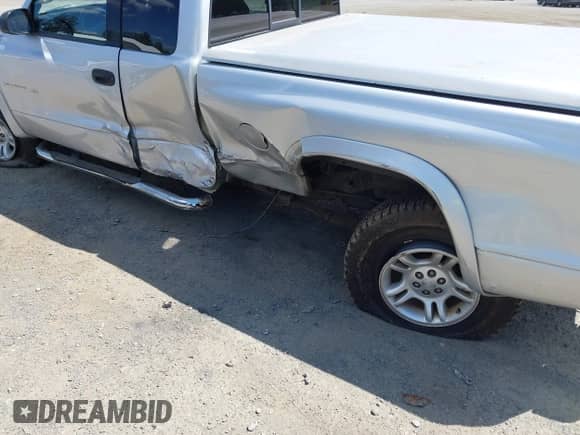 2001 Dodge Dakota Sport with VIN 1B7GG22N31S209673, listed as a IAAI auction lot 42711330 with 151,824 mi miles and . Bid and sale history available at DreamBid. Image 6.