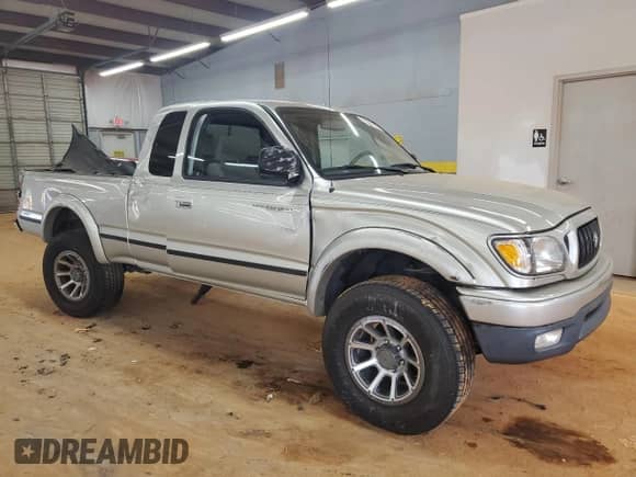2003 Toyota Tacoma PreRunner with VIN 5TESN92N43Z220494, listed as a Copart auction lot 71327755 with 164,737 mi miles and Salvage title. Bid and sale history available at DreamBid. Image 4.