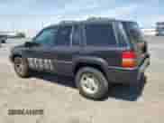1998 Jeep Grand Cherokee Limited z VIN 1J4GZ78Y5WC185820, wystawiony jako Copart lot #67221725 z przebiegiem 280 414 mil mil oraz Szkoda całkowita • Salvage title. Historia ofert i sprzedaży dostępna na DreamBid. Obrazek 2.