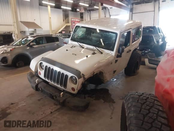 2012 Jeep Wrangler Arctic with VIN 1C4AJWBG9CL233232, listed as a IAAI auction lot 42282805 with 109,927 mi miles and . Bid and sale history available at DreamBid. Image 2.
