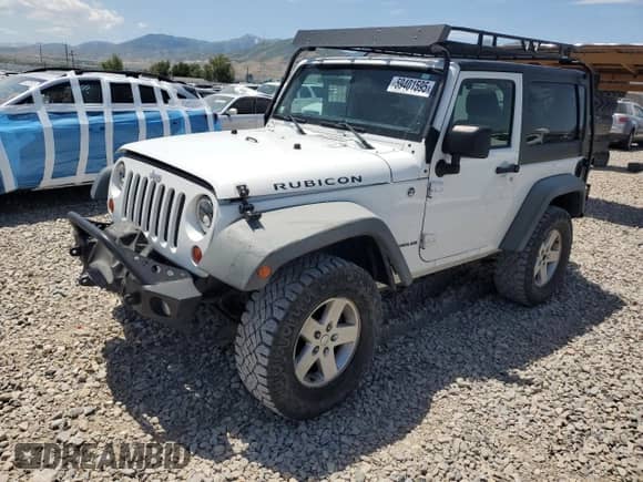 2011 Jeep Wrangler Rubicon with VIN 1J4BA6D12BL535953, listed as a Copart auction lot 59401595 with 77,451 mi miles and Salvage title. Bid and sale history available at DreamBid. Image 1.