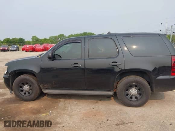 2014 Chevrolet Tahoe Commercial z VIN 1GNLC2E03ER212670, wystawiony jako IAAI lot #42397479 z przebiegiem 106 756 mil mil oraz . Historia ofert i sprzedaży dostępna na DreamBid. Obrazek 14.