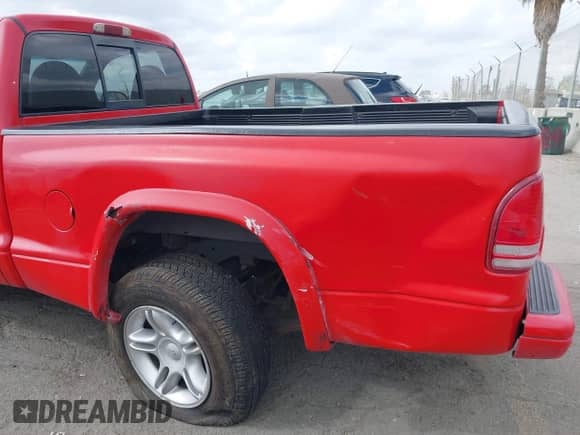 1999 Dodge Dakota SLT with VIN 1B7GL26Z5XS217114, listed as a IAAI auction lot 43418147 with 145,280 mi miles and . Bid and sale history available at DreamBid. Image 6.