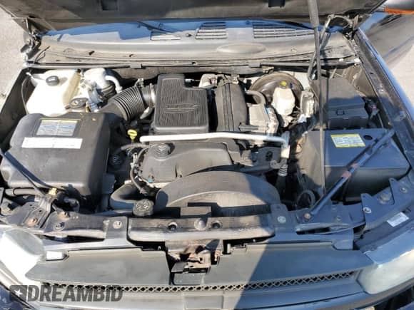 2005 Chevrolet TrailBlazer LT with VIN 1GNES16SX56180758, listed as a Copart auction lot 64701205 with 151,000 mi miles and Salvage title. Bid and sale history available at DreamBid. Image 12.