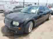 2006 Chrysler 300 C SRT-8 with VIN 2C3LA73W26H346661, listed as a IAAI auction lot 42990681 with 129,580 mi miles and . Bid and sale history available at DreamBid. Image 2.