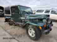 2001 Jeep Wrangler Sahara с VIN 1J4FA59S11P370224, выставлен на аукционе Copart как лот 85285925 с пробегом 87 080 миль миль и Списание • Salvage title. История ставок и продаж доступна на DreamBid. Изображение 4.