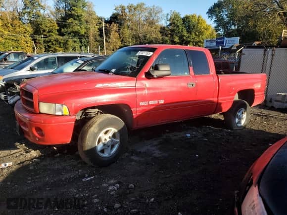 2000 Dodge 1500 with VIN 1B7HF13Z5YJ190790, listed as a Copart auction lot 87027165 with 128,358 mi miles and Salvage title. Bid and sale history available at DreamBid. Image 1.