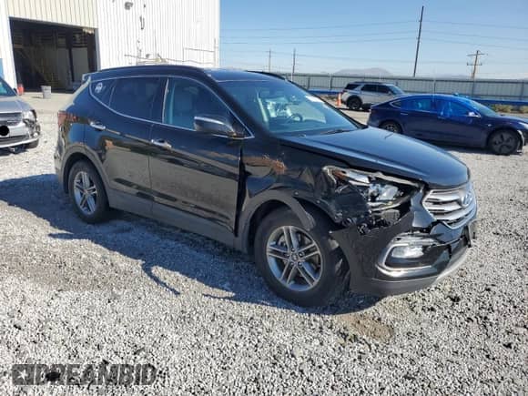 2018 Hyundai Santa Fe 2.4L с VIN 5XYZU3LB2JG543372, выставлен на аукционе Copart как лот 70165375 с пробегом 99 197 миль миль и Списание • Salvage title. История ставок и продаж доступна на DreamBid. Изображение 4.