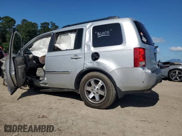 2009 Honda Pilot Touring with VIN 5FNYF38809B002505, listed as a Copart auction lot 61857065 with Not provided miles and Salvage title. Bid and sale history available at DreamBid. Image 2.