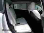 2023 Tesla Model Y Long Range with VIN 7SAYGAEE2PF590760, listed as a Copart auction lot 69752835 with 57,026 mi miles and Salvage title. Bid and sale history available at DreamBid. Image 11.