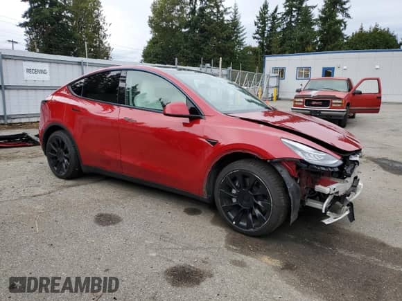 2021 Tesla Model Y Long Range with VIN 5YJYGAEE2MF215721, listed as a Copart auction lot 84570055 with 42,763 mi miles and Salvage title. Bid and sale history available at DreamBid. Image 4.