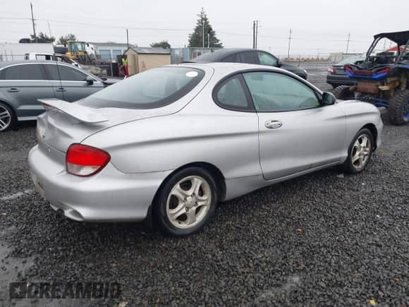 2001 Hyundai Tiburon с VIN KMHJG25F81U267658, выставлен на аукционе IAAI как лот 41092438 с пробегом 188 575 миль миль и . История ставок и продаж доступна на DreamBid. Изображение 4.