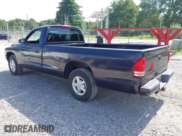 1999 Dodge Dakota SLT z VIN 1B7FL26XXXS181270, wystawiony jako IAAI lot #42805596 z przebiegiem 26 583 mil mil oraz . Historia ofert i sprzedaży dostępna na DreamBid. Obrazek 3.