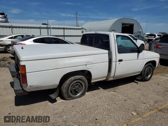 1992 Nissan Frontier XE with VIN 1N6SD11S5NC351492, listed as a Copart auction lot 69573075 with 245,280 mi miles and Salvage title. Bid and sale history available at DreamBid. Image 3.