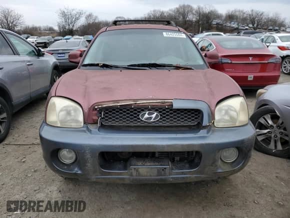 2002 Hyundai Santa Fe GLS z VIN KM8SC73D22U153199, wystawiony jako Copart lot #86425594 z przebiegiem 252 992 mil mil oraz Nie do naprawy • Non repairable. Historia ofert i sprzedaży dostępna na DreamBid. Obrazek 5.