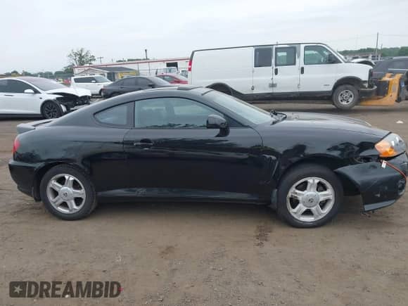 2003 Hyundai Tiburon GT с VIN KMHHN65FX3U087872, выставлен на аукционе IAAI как лот 42607169 с пробегом 196 005 миль миль и . История ставок и продаж доступна на DreamBid. Изображение 13.