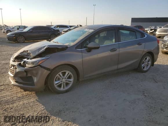 2018 Chevrolet Cruze LT with VIN 1G1BE5SM8J7156764, listed as a Copart auction lot 71676335 with 134,999 mi miles and Salvage title. Bid and sale history available at DreamBid. Image 1.