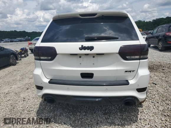 2014 Jeep Grand Cherokee SRT-8 z VIN 1C4RJFDJ2EC242210, wystawiony jako Copart lot #60677855 z przebiegiem 68 050 mil mil oraz Szkoda całkowita • Salvage title. Historia ofert i sprzedaży dostępna na DreamBid. Obrazek 6.