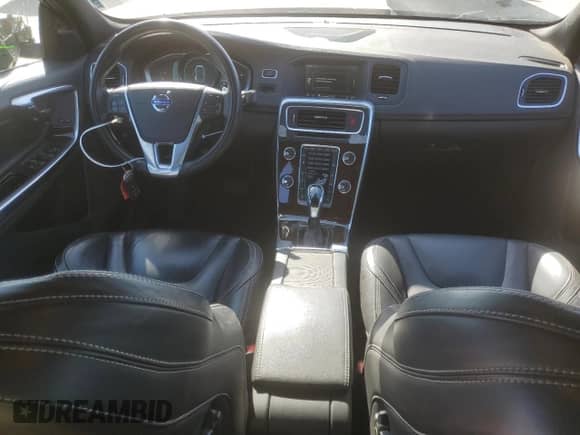 2015 Volvo S60 with VIN YV126MFD0F1309666, listed as a Copart auction lot 77844894 with 130,570 mi miles and Salvage title. Bid and sale history available at DreamBid. Image 8.