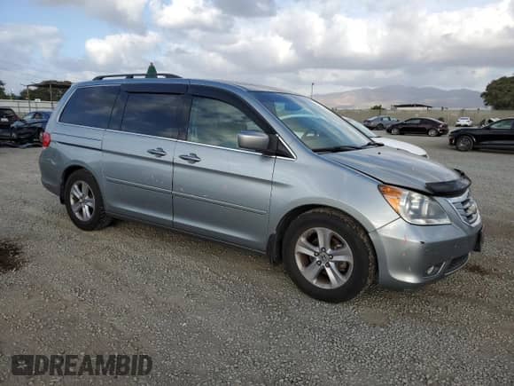 2009 Honda Odyssey Touring with VIN 5FNRL38989B040375, listed as a Copart auction lot 82321765 with 167,692 mi miles and Salvage title. Bid and sale history available at DreamBid. Image 4.