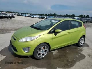 2012 Ford Fiesta SES with VIN 3FADP4FJ6CM117710, listed as a Copart auction lot 64371335 with 92,029 mi miles and Salvage title. Bid and sale history available at DreamBid. Image 1.