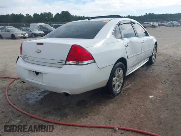 2014 Chevrolet Impala LT with VIN 2G1WB5E34E1135720, listed as a IAAI auction lot 43297070 with Not provided miles and . Bid and sale history available at DreamBid. Image 4.