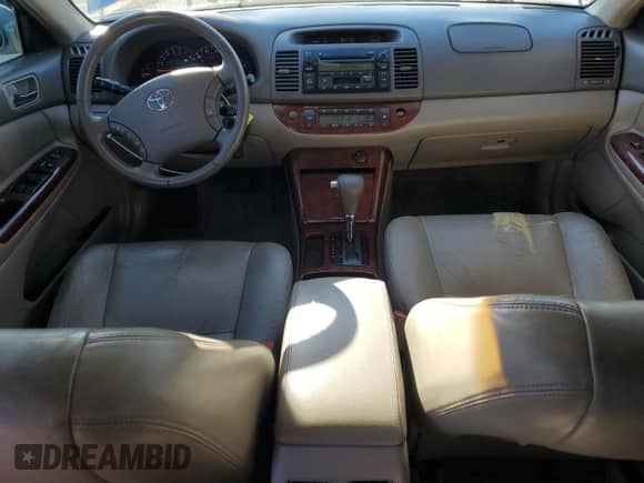 2005 Toyota Camry LE с VIN JTDBF30KX50160730, выставлен на аукционе Copart как лот 84997435 с пробегом 238 964 миль миль и Списание • Salvage title. История ставок и продаж доступна на DreamBid. Изображение 8.