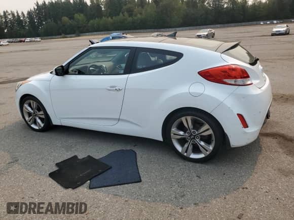 2014 Hyundai Veloster z VIN KMHTC6ADXEU187204, wystawiony jako Copart lot #71670725 z przebiegiem 94 917 mil mil oraz Czysty tytuł • Clean title. Historia ofert i sprzedaży dostępna na DreamBid. Obrazek 2.