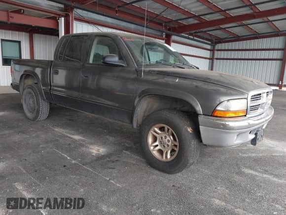 2002 Dodge Dakota SLT with VIN 1B7HG48N62S546265, listed as a IAAI auction lot 43315504 with 169,858 mi miles and . Bid and sale history available at DreamBid. Image 1.
