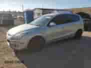 2009 Hyundai Elantra Touring with VIN KMHDC86E09U038792, listed as a Copart auction lot 84791125 with 172,061 mi miles and Salvage title. Bid and sale history available at DreamBid. Image 1.