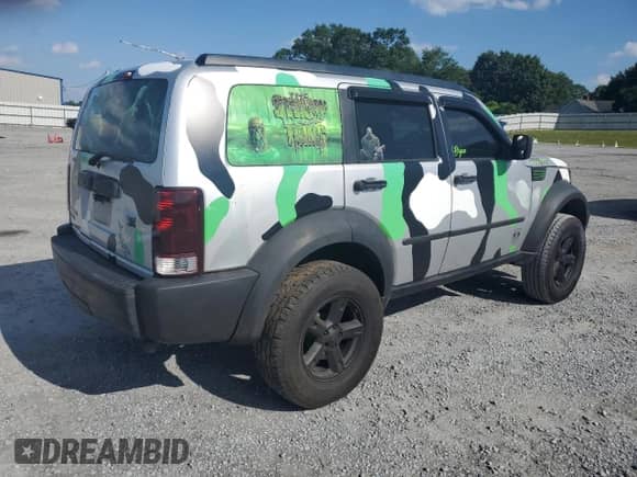 2007 Dodge Nitro SLT with VIN 1D8GT58K87W634576, listed as a Copart auction lot 58013705 with 309,569 mi miles and Salvage title. Bid and sale history available at DreamBid. Image 3.