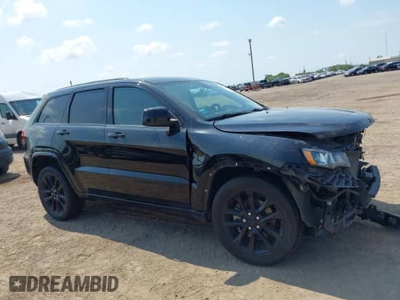 2021 Jeep Grand Cherokee Laredo E with VIN 1C4RJEAG8MC596881, listed as a IAAI auction lot 43050572 with 70,902 mi miles and . Bid and sale history available at DreamBid. Image 14.