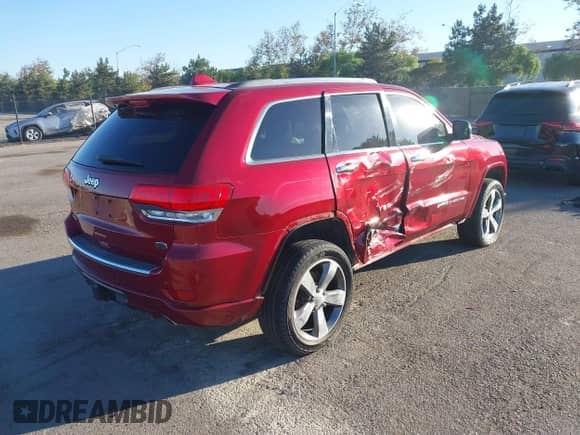 2015 Jeep Grand Cherokee Overland z VIN 1C4RJFCG6FC613232, wystawiony jako IAAI lot #43476794 z przebiegiem 106 697 mil mil oraz . Historia ofert i sprzedaży dostępna na DreamBid. Obrazek 4.