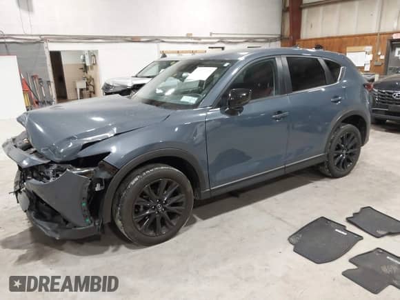 2022 Mazda CX-5 S Preferred z VIN JM3KFBCM1N0551165, wystawiony jako IAAI lot #42277023 z przebiegiem 34 115 mil mil oraz . Historia ofert i sprzedaży dostępna na DreamBid. Obrazek 16.