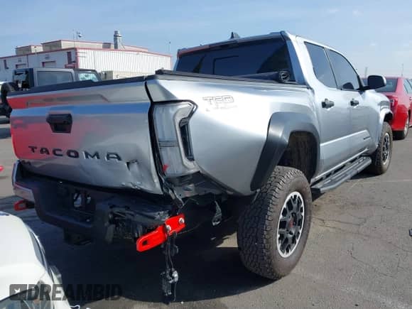 2024 Toyota Tacoma SR5 with VIN 3TMLB5JN6RM022612, listed as a IAAI auction lot 41611378 with 7,275 mi miles and . Bid and sale history available at DreamBid. Image 4.