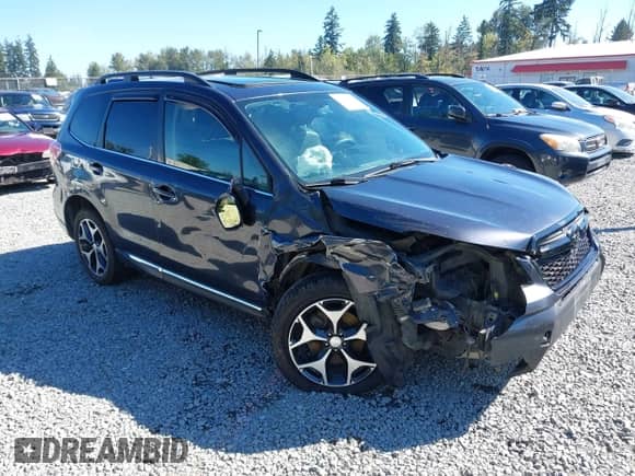 2015 Subaru Forester XT Touring with VIN JF2SJGWC0FH473070, listed as a IAAI auction lot 43024485 with 220,181 mi miles and . Bid and sale history available at DreamBid. Image 1.