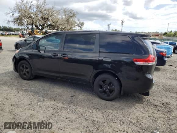 2014 Toyota Sienna L with VIN 5TDZK3DCXES461170, listed as a Copart auction lot 82210975 with 211,086 mi miles and Salvage title. Bid and sale history available at DreamBid. Image 2.