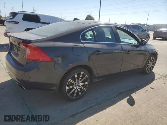 2015 Volvo S60 with VIN YV126MFD0F1309666, listed as a Copart auction lot 77844894 with 130,570 mi miles and Salvage title. Bid and sale history available at DreamBid. Image 3.