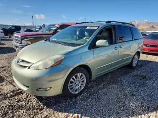 2010 Toyota Sienna XLE Limited with VIN 5TDYK4CC5AS300447, listed as a Copart auction lot 86306465 with 223,993 mi miles and Clean title. Bid and sale history available at DreamBid. Image 1.