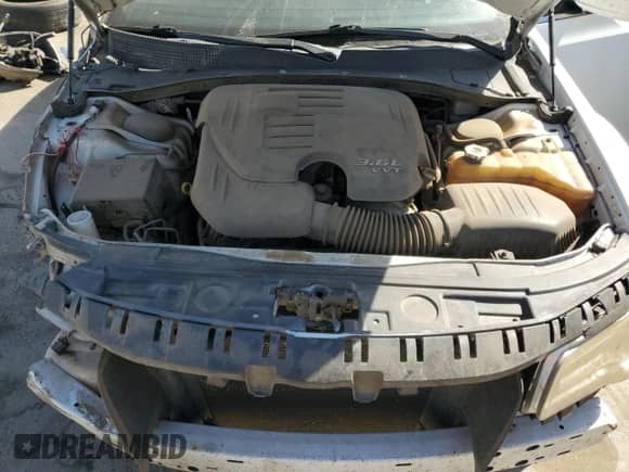 2012 Chrysler 300 S z VIN 2C3CCABG5CH253128, wystawiony jako Copart lot #69519404 z przebiegiem 157 799 mil mil oraz Szkoda całkowita • Salvage title. Historia ofert i sprzedaży dostępna na DreamBid. Obrazek 11.