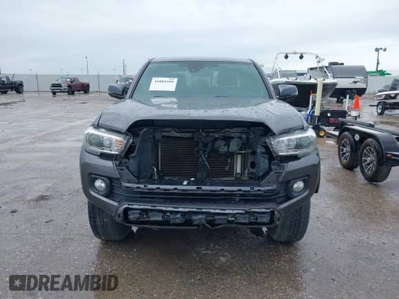 2021 Toyota Tacoma SR5 с VIN 5TFAZ5CNXMX097509, выставлен на аукционе IAAI как лот 41889399 с пробегом 81 598 миль миль и . История ставок и продаж доступна на DreamBid. Изображение 13.