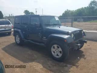 2007 Jeep Wrangler Unlimited Sahara z VIN 1J4GA591X7L117415, wystawiony jako IAAI lot #42509979 z przebiegiem 96 192 mil mil oraz . Historia ofert i sprzedaży dostępna na DreamBid. Obrazek 1.