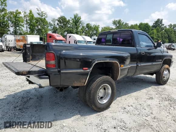 1994 Dodge RAM with VIN 1B7MF3654RS708967, listed as a Copart auction lot 59077115 with 89,023 mi miles and Salvage title. Bid and sale history available at DreamBid. Image 3.