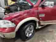 2015 Ram 1500 Laramie Longhorn with VIN 1C6RR7PM0FS532044, listed as a IAAI auction lot 41601998 with 117,649 mi miles and . Bid and sale history available at DreamBid. Image 6.