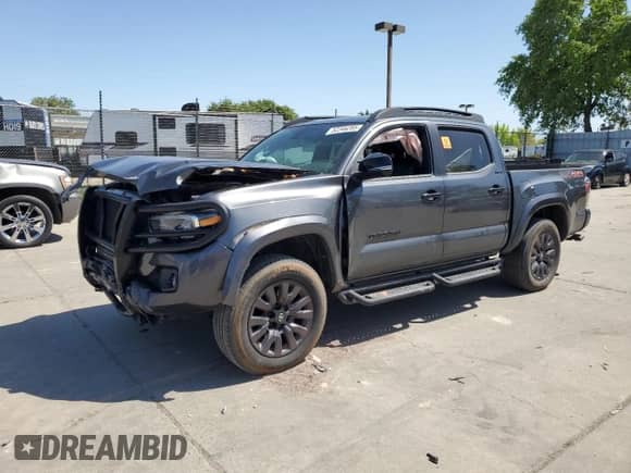 2021 Toyota Tacoma Limited with VIN 3TMGZ5AN0MM420386, listed as a Copart auction lot 52346285 with 49,912 mi miles and Salvage title. Bid and sale history available at DreamBid. Image 1.