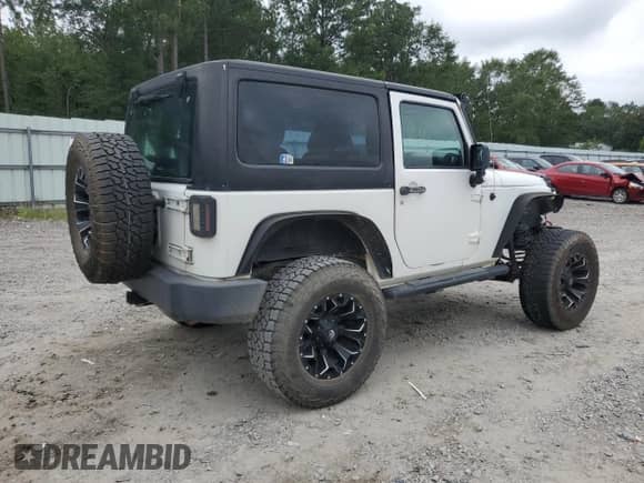 2013 Jeep Wrangler Sport with VIN 1C4AJWAG2DL512251, listed as a Copart auction lot 68094295 with 153,366 mi miles and Salvage title. Bid and sale history available at DreamBid. Image 3.