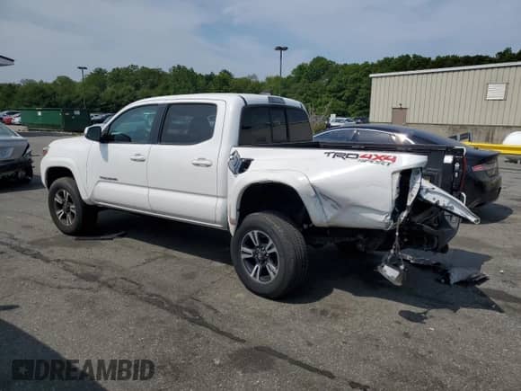 2016 Toyota Tacoma TRD Sport z VIN 3TMCZ5AN5GM009665, wystawiony jako Copart lot #59667805 z przebiegiem 54 183 mil mil oraz Szkoda całkowita • Salvage title. Historia ofert i sprzedaży dostępna na DreamBid. Obrazek 2.