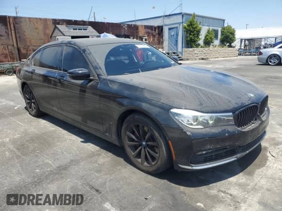 2017 BMW 7 Series 740i with VIN WBA7E2C36HG740606, listed as a Copart auction lot 65196225 with 84,940 mi miles and Salvage title. Bid and sale history available at DreamBid. Image 4.